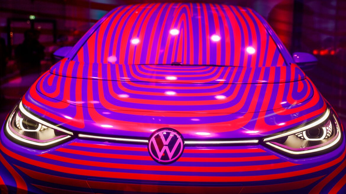 A Volkswagen ID 3 electric car is seen in a glass cage during a press conference in Berlin on May 8, 2019. - Volkswagen launched pre-orders via a microsite at a press conference in the German capital today for the ID.3 1st Plus - a high-spec, launch edition version of the Volkswagen brand's first ID. model. The first deliveries of the vehicle on the MEB all-electric platform are scheduled in the sumer of 2020.