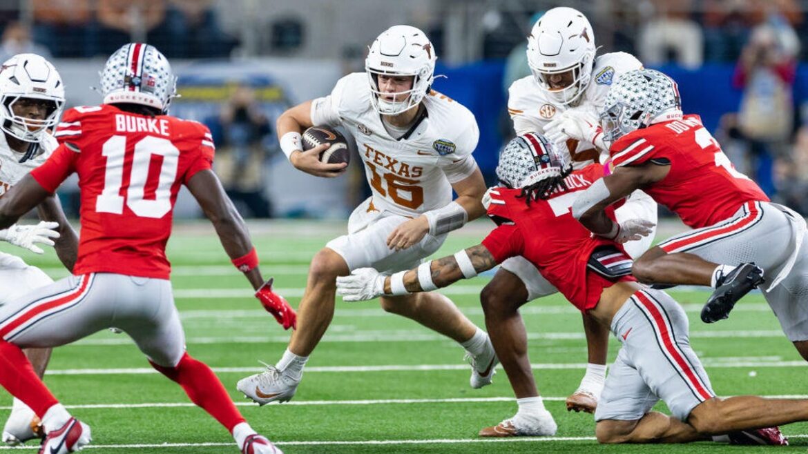 Texas Longhorns quarterback Arch Manning (#16) runs up field for a first down during the CFP Semifinal Cotton Bowl Classic football game between the Ohio State Buckeyes and Texas Longhorns on January 10, 2025 at AT&T Stadium in Arlington, TX