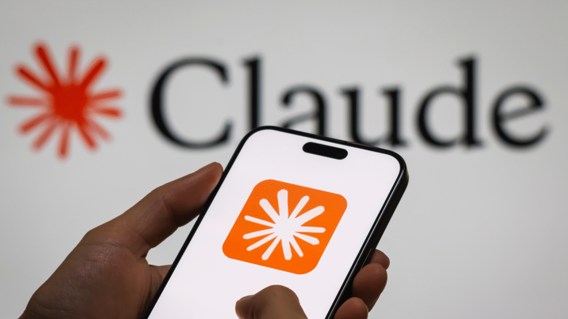 CHONGQING, CHINA - DECEMBER 29: In this photo illustration, a person holds a smartphone displaying the logo of “Claude,” an AI language model by Anthropic, with the company’s logo visible in the background, illustrating the rapid development and adoption of generative AI technologies, on December 29, 2024 in Chongqing, China. Artificial Intelligence (AI) has become a cornerstone of China’s strategic ambitions, with the government aiming to establish the country as a global leader in AI by 2030.