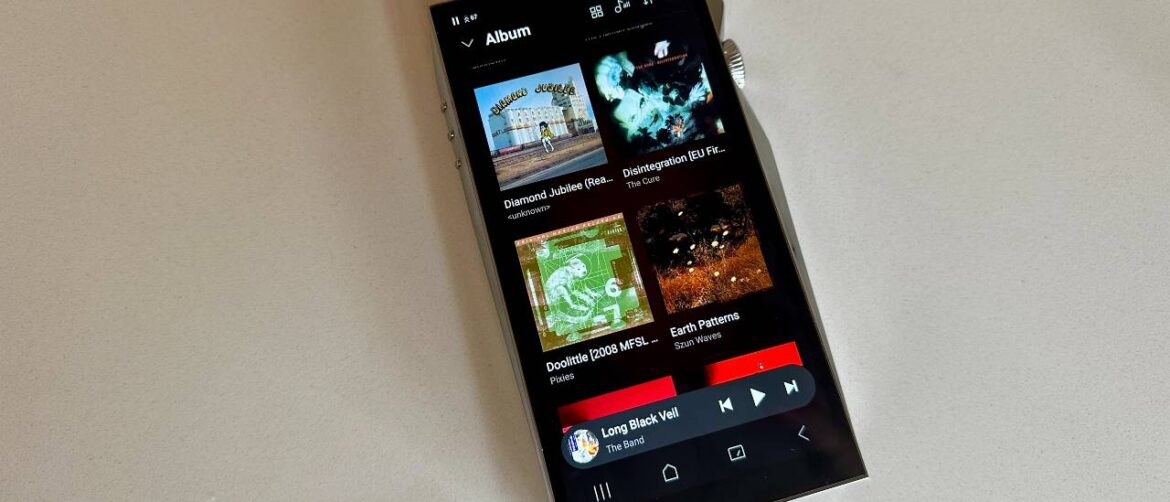 Astell &amp; Kern A&amp;ultima SP4000 portable music player on a white surface