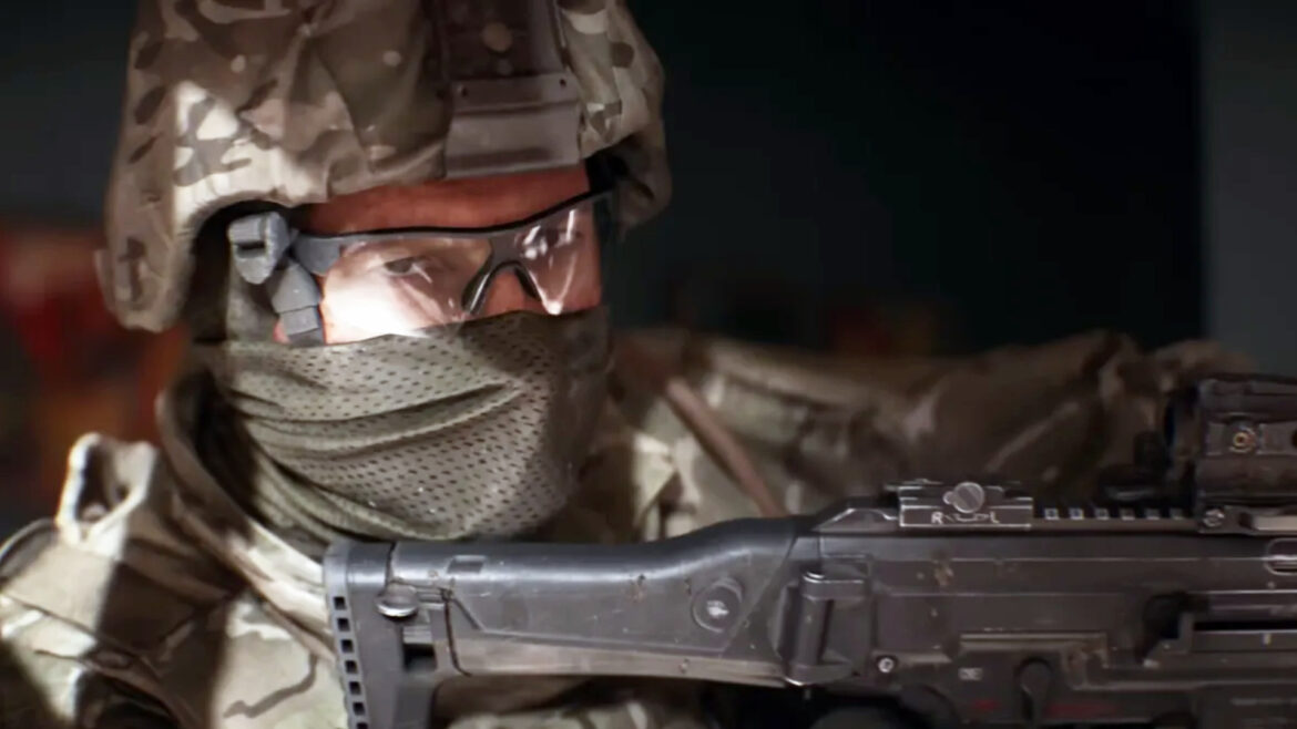 Battlefield 6 ui redesigns: A close-up shot of a soldier wearing full headgear turning to look at the camera while holding their gun up.