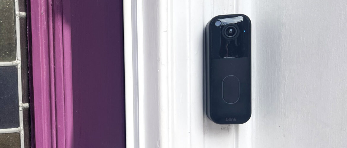 Blink Video Doorbell Gen 2 mounted beside purple door