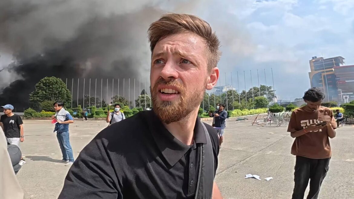 IShowSpeed holding hands together in back of car