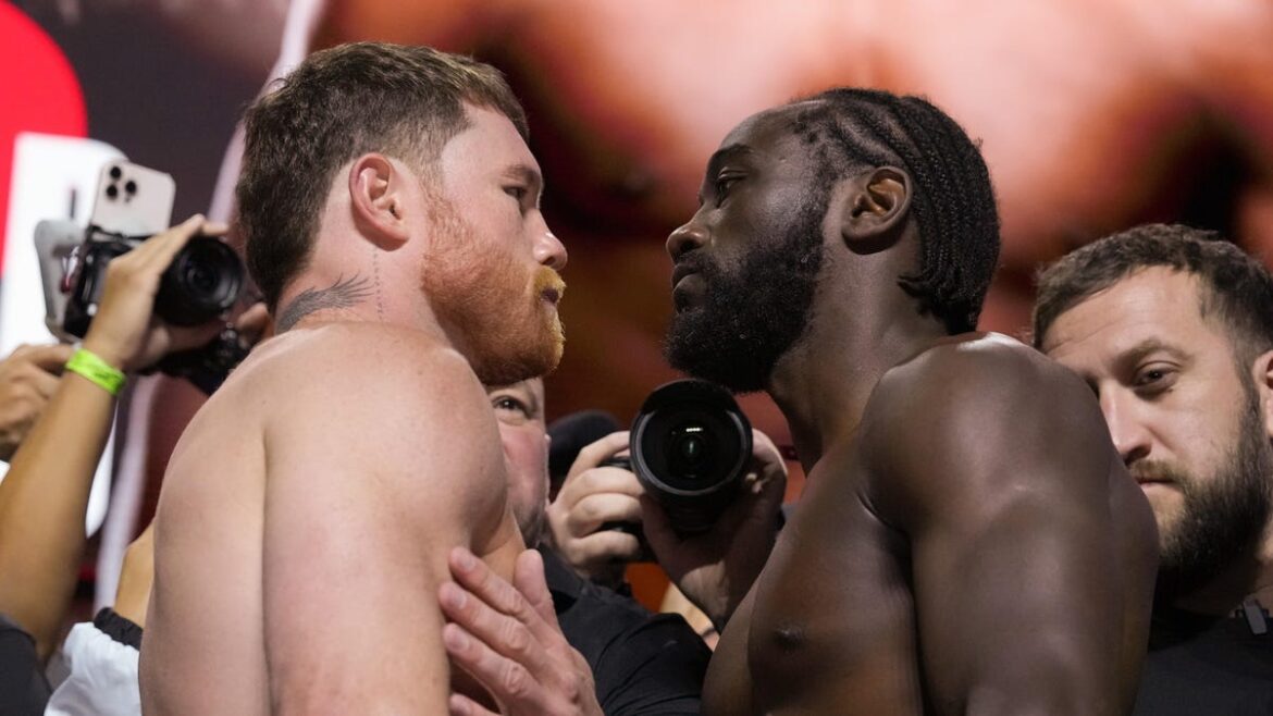 canelo alvarez and terrence crawford face each other at weigh-in
