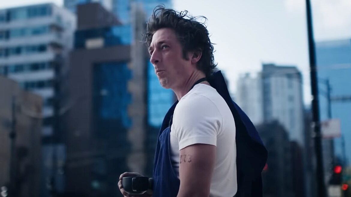 Peacemaker holding a huge gun.