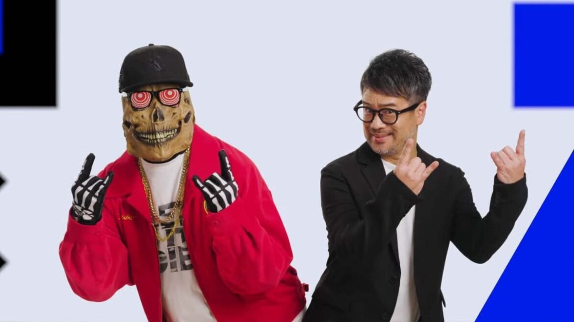 Two guys doing devil horns.