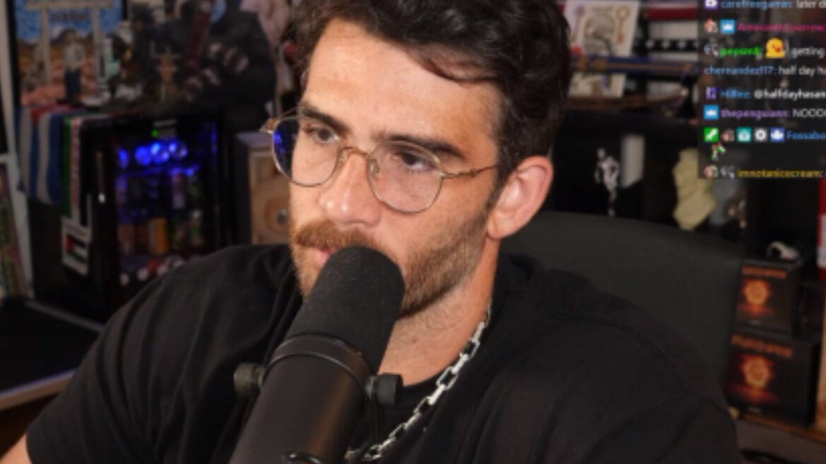 hasan in front of a plant while streaming on twitch