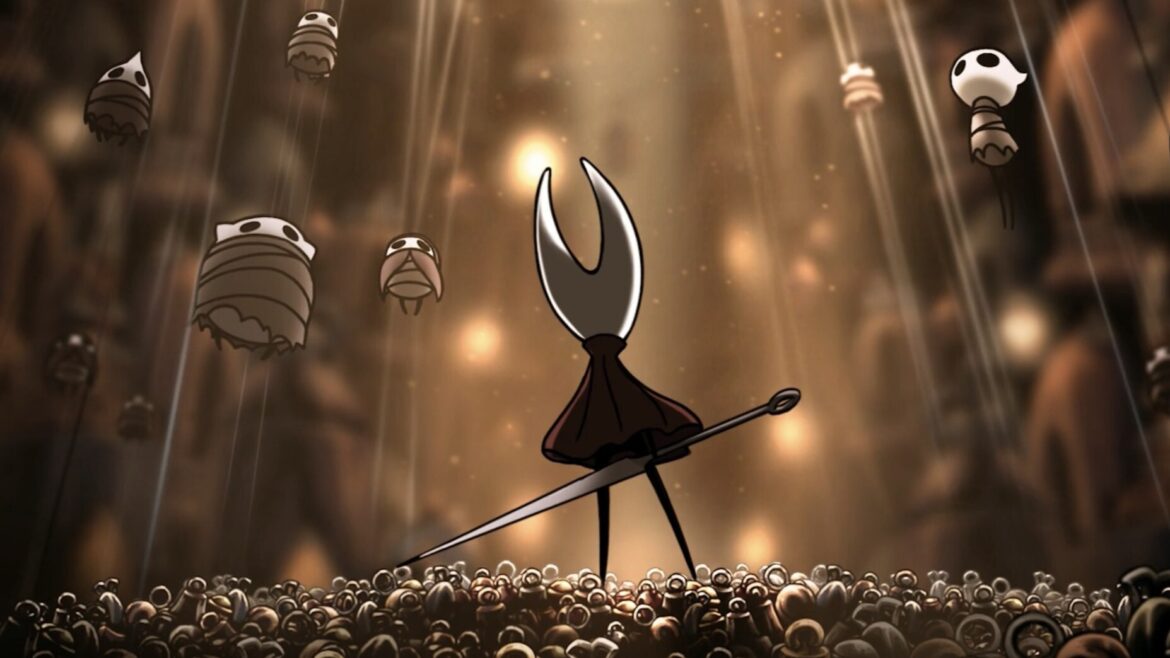 I spent all weekend playing Hollow Knight Silksong and I’m The protagonist of Hollow Knight Silksong, Hornet, looks up at a crowd of bugs suspended from the ceiling in web