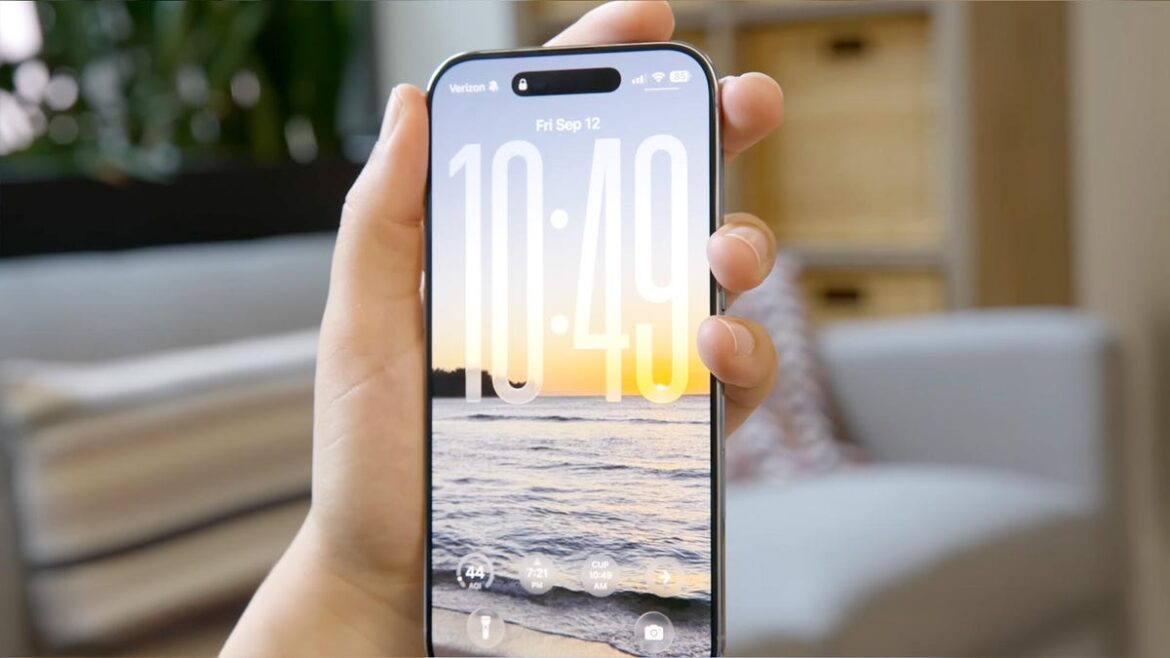 The iPhone Air in hand, with a wallpaper of the beach