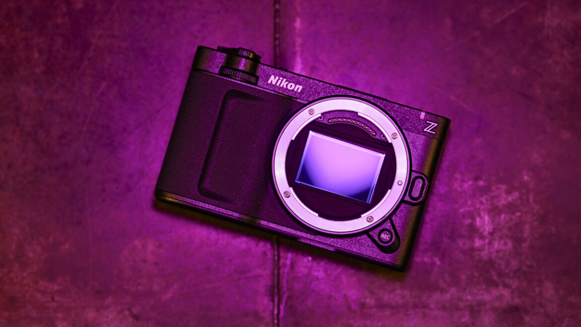 Nikon ZR camera, no lens, under low key magenta lighting