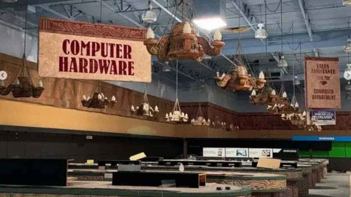 An abandoned Fry's electronics shows signs for computer hardware.