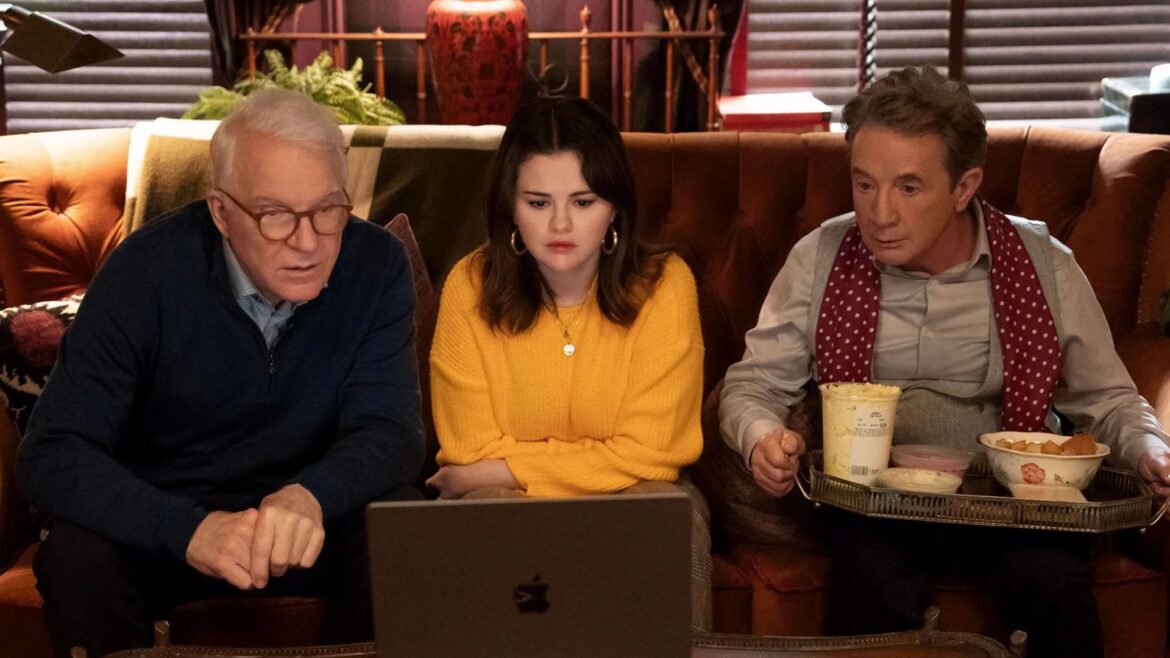 You can stream the first 3 episodes of Only Murders Steve Martin, Selena Gomez and Martin Short sit on a couch looking at a laptop, with a tray of food on Short's lap