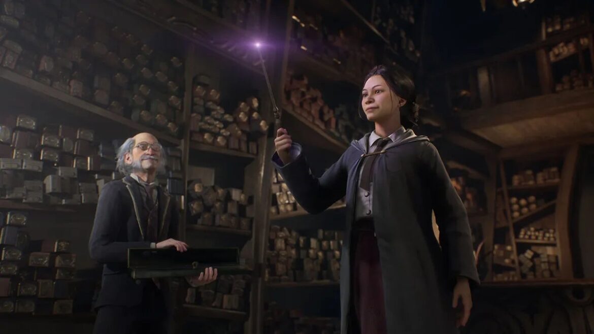 A student at Hogwarts holds a wand.